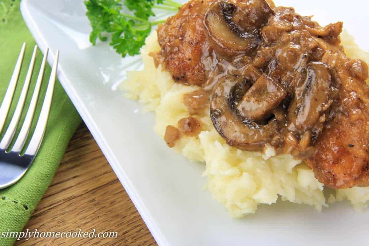 chicken and mushroom marsala on top of mashed potatoes