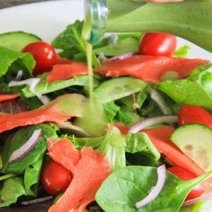mixed baby greens with smoked salmon, cucumbers, and red onion salad