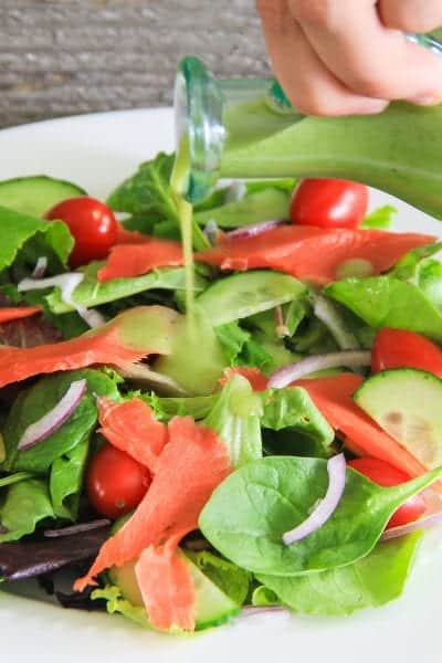 mixed baby greens with smoked salmon, cucumbers, and red onion salad