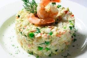seafood salad with shrimp and dill on top