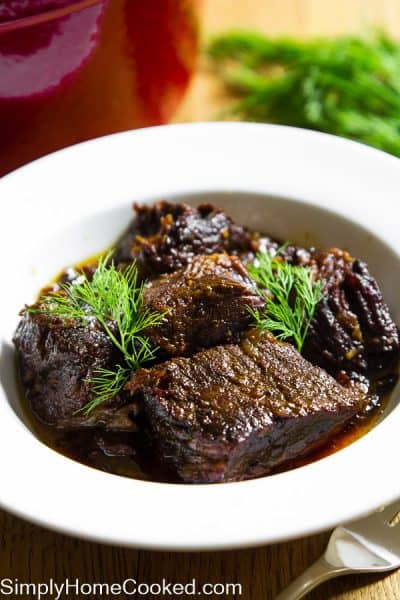 Braised Beef with fresh dill in a white bowl