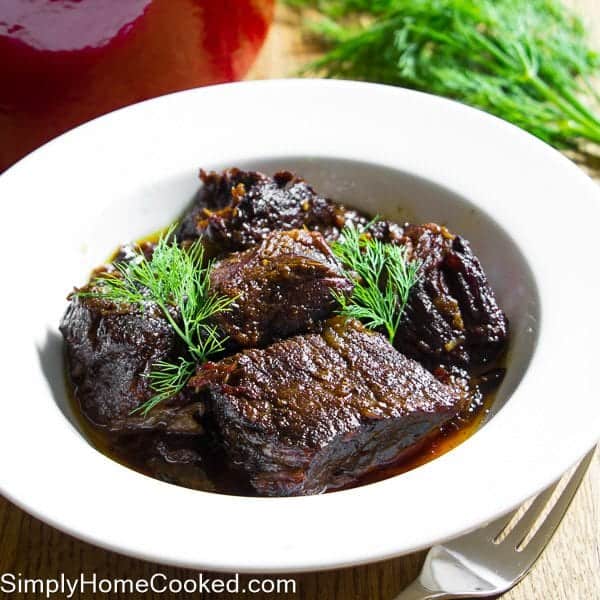 Braised Beef with fresh dill in a white bowl