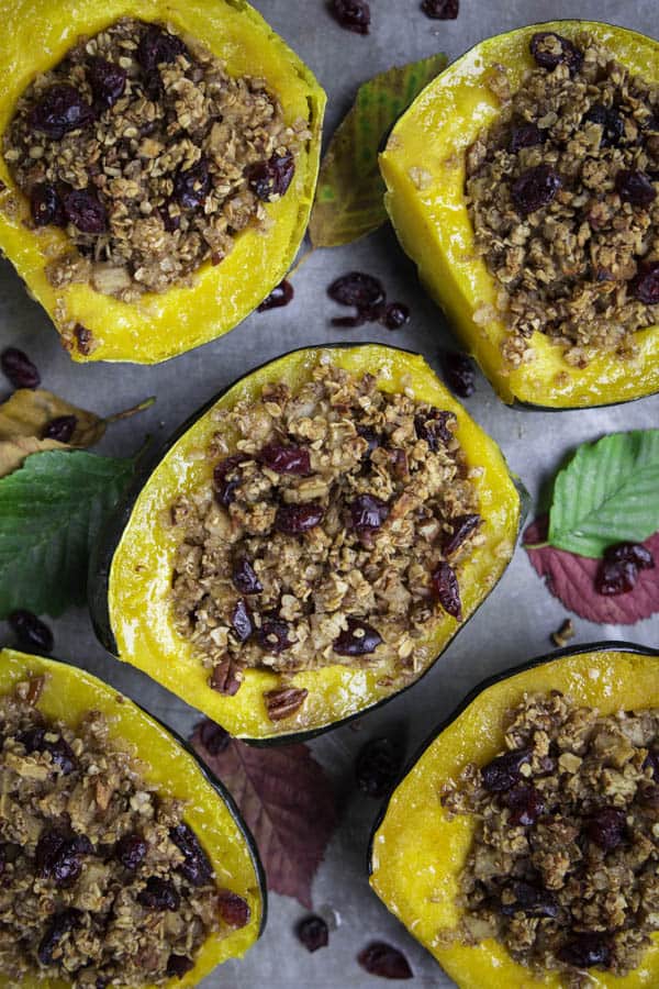 an overhead image of baked acorn squash stuffed with oatmeal 