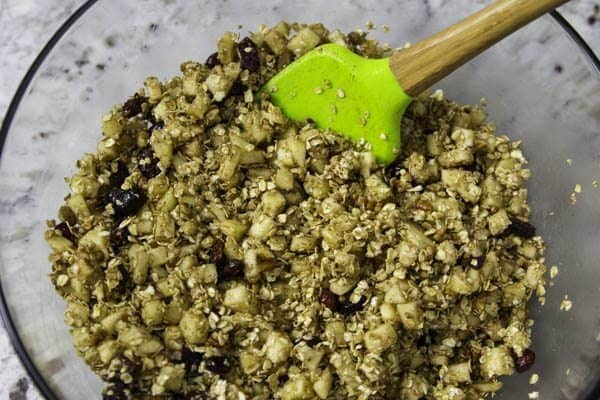 a close up image of butter, diced apples, cinnamon, and oatmeal in a bowl