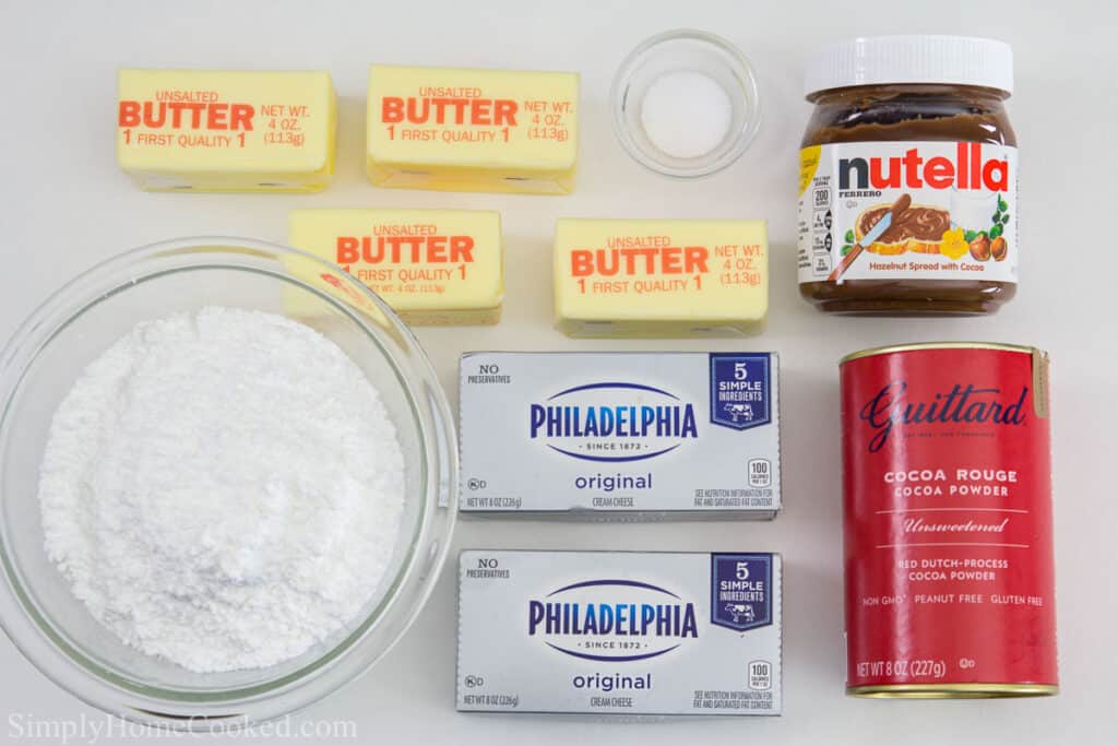 Ingredients for Nutella buttercream frosting for Nutella Cake, including Nutella, dutch processed cocoa powder, butter, cream cheese, powdered sugar, and salt.