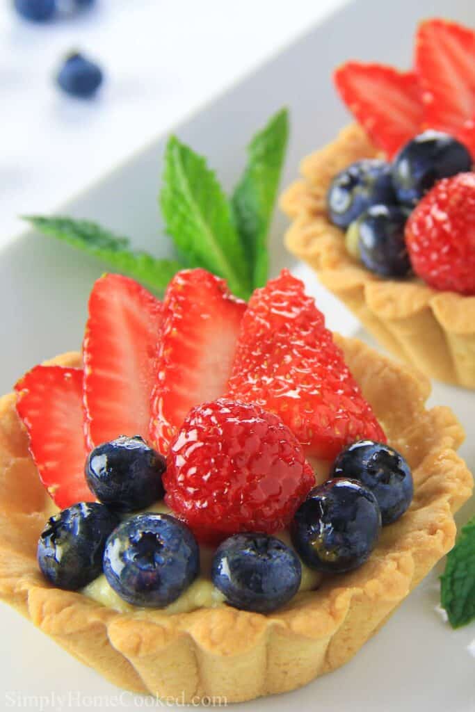 Close up image of a Mini Fruit Tart and another in the background 