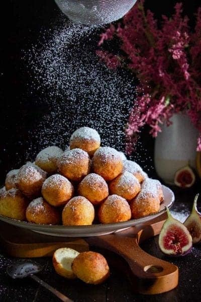 Doughnut holes with powdered sugar