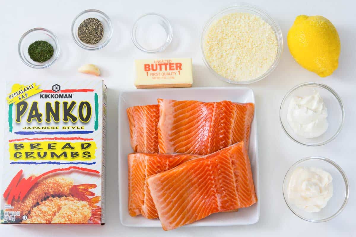 These salmon fillets are smothered in lemony mayonnaise and topped with buttery herbed Panko bread crumbs. #salmonrecipe #easysalmon #quicksalmon #pankosalmon #breadedsalmon overhead image of ingredients for panko parmesan salmon