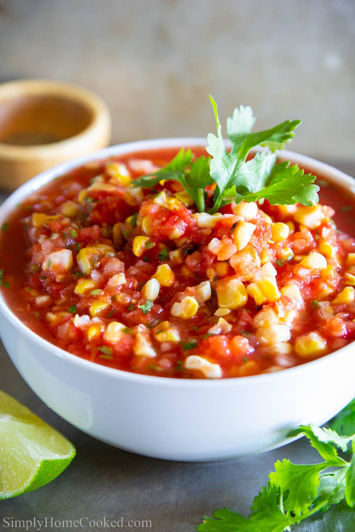 Bowl of Grilled Corn Salsa topped with fresh cilantro.