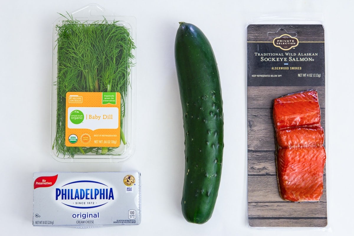 Ingredients for Smoked Salmon Appetizers: cucumber, smoked salmon, cream cheese, and dill.