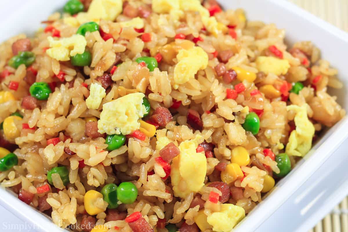 close up image of the best and most simple fried rice thats made with pork, peas, corn, carrot, and egg