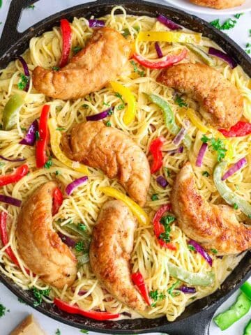 overhead image of chicken scampi pasta in a cast iron pan