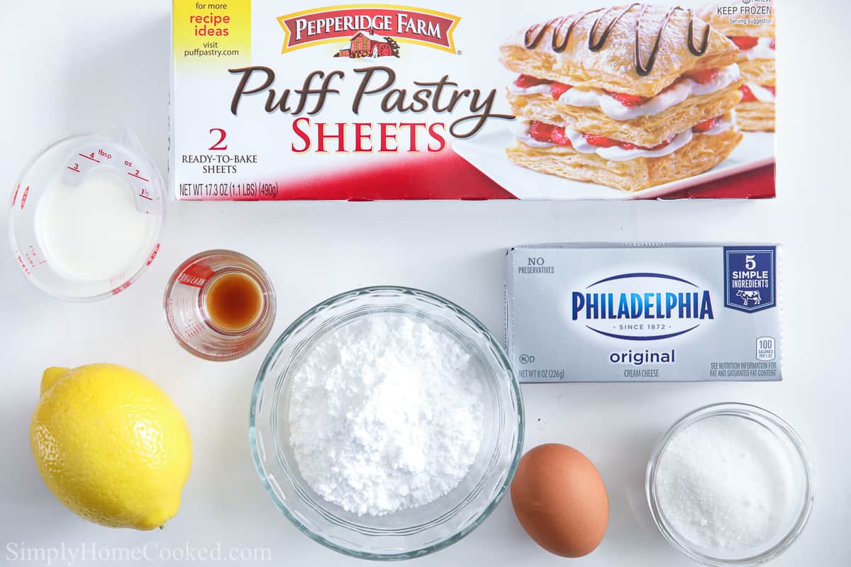 Ingredients for Cheese Danish, including puff pastry, cream cheese, vanilla, egg, lemon zest, cream, sugar, and powdered sugar. 