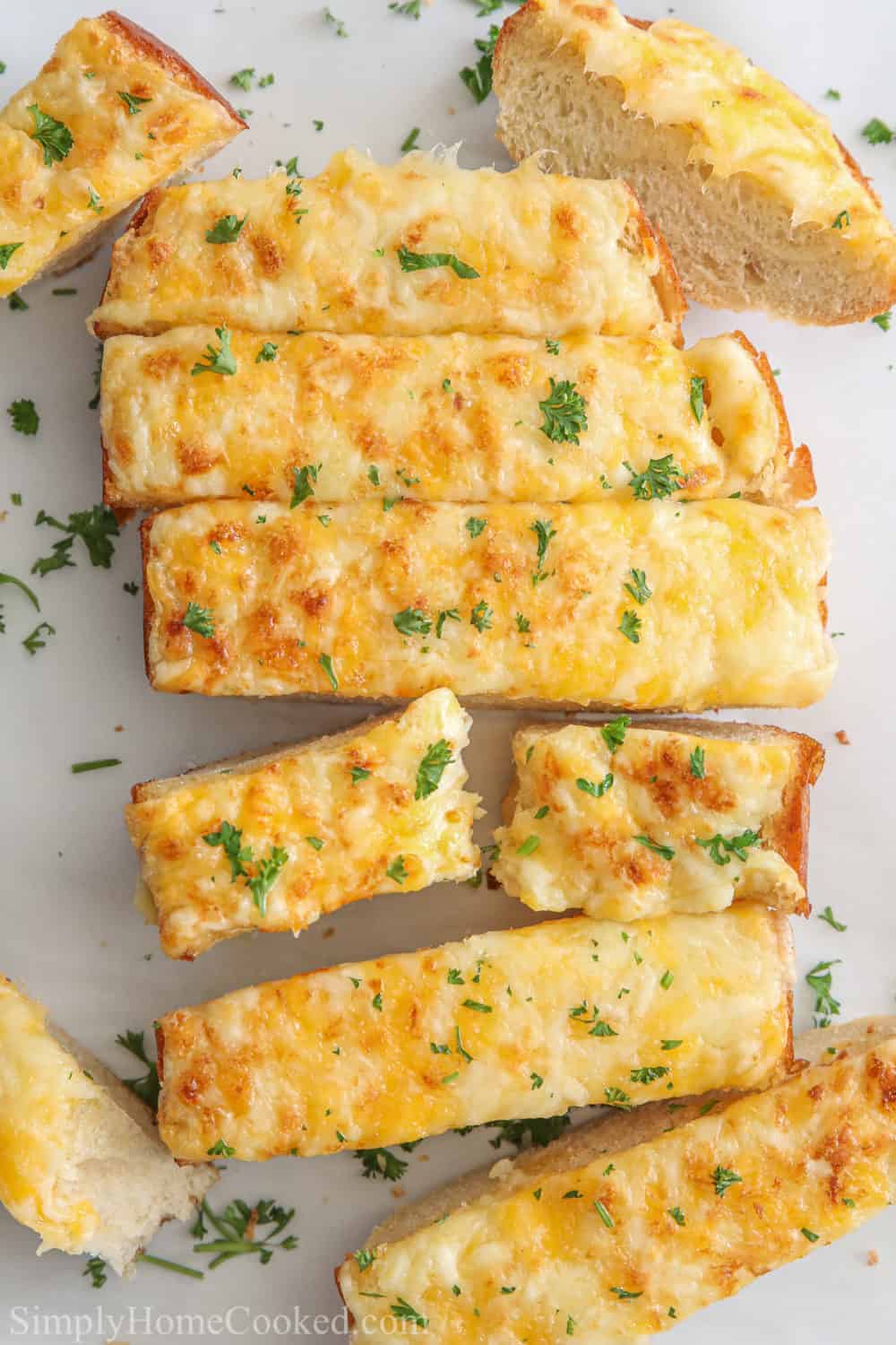 Slices of Garlic Cheese Bread garnished with parsley.