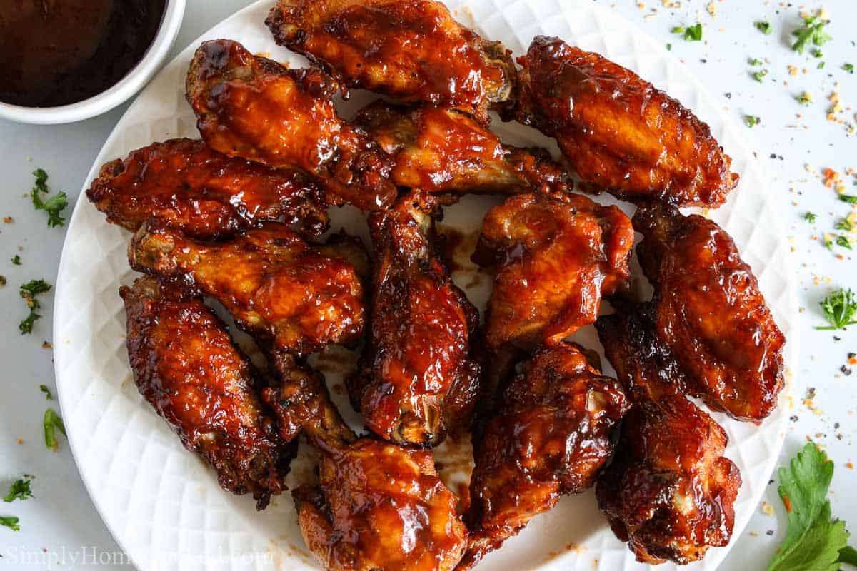 barbecue chicken wings on a white plate