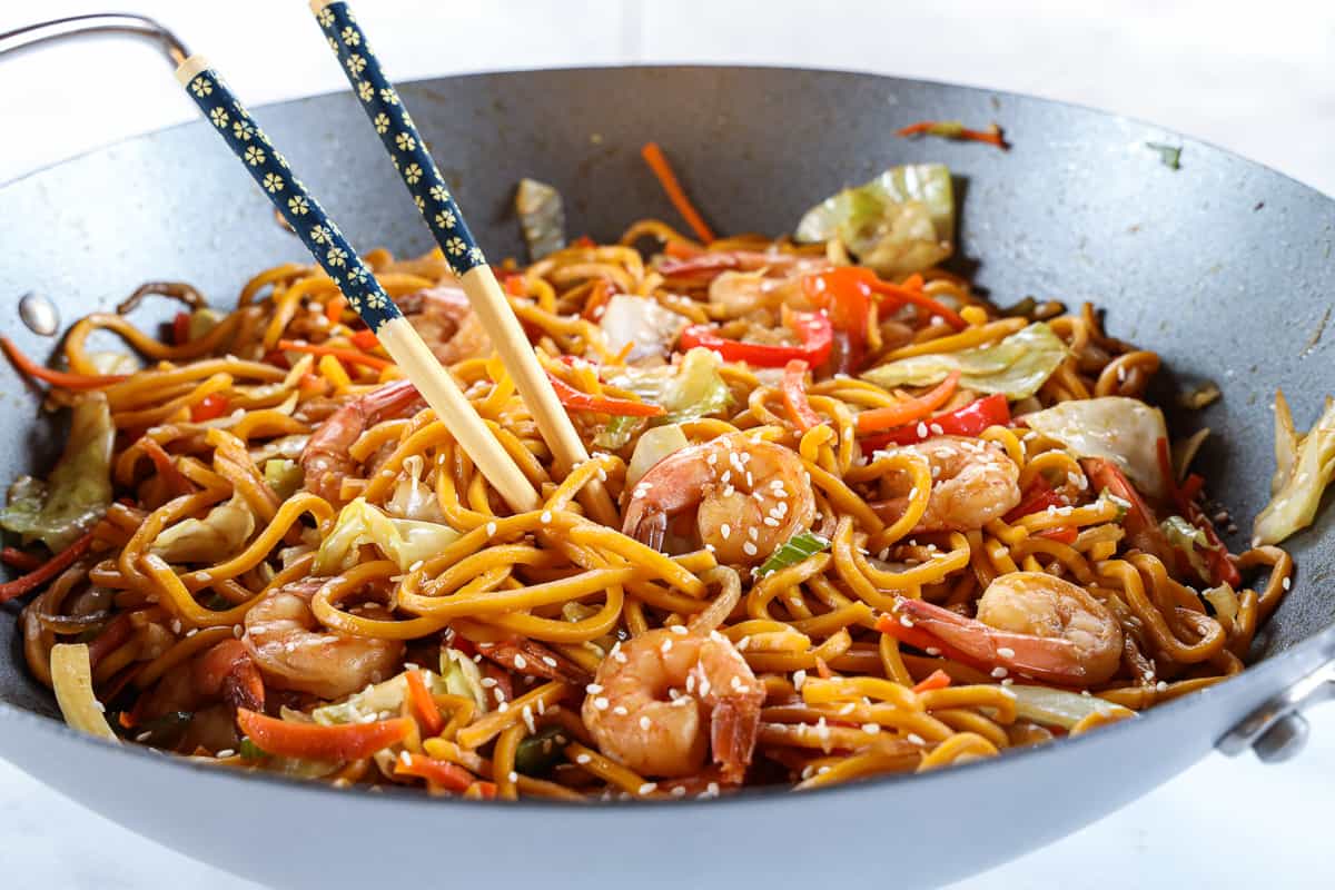 30-Minute Shrimp Chow Mein in a wok with chopsticks in it.