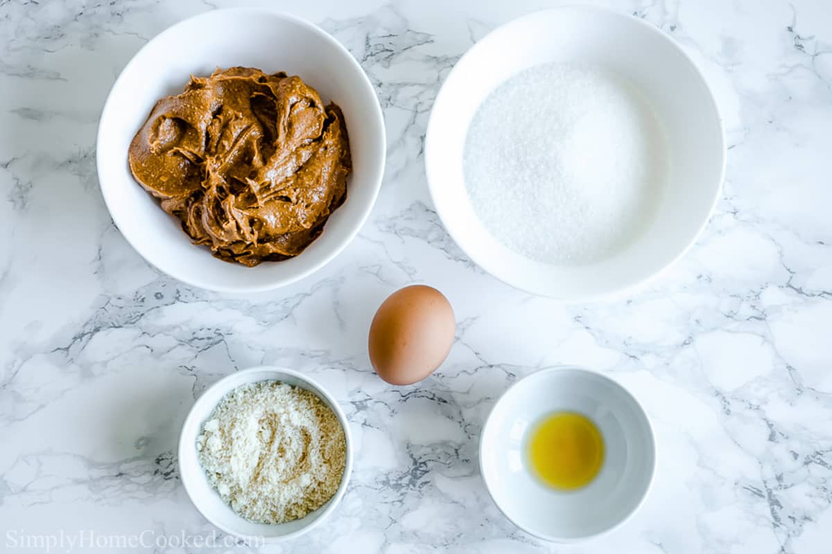 Ingredients for Easy Keto Peanut Butter Cookies, including peanut butter, almond flour, egg, salt, vanilla, and low carb sweetener.