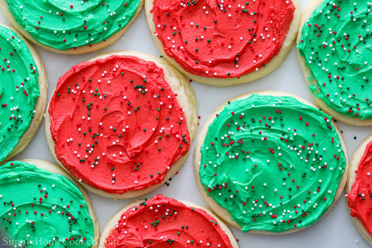 Horizontal image of Lofthouse Frosted Sugar Cookies with red an green frosting and sprinkles.