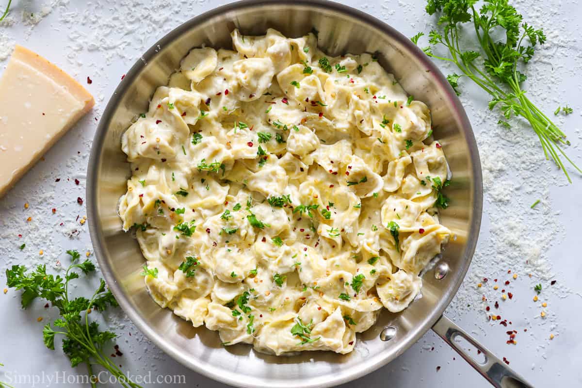 Creamy Tortellini Alfredo in a stainless steal pan