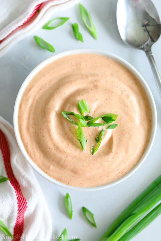 Overview of bowl of Yum Yum sauce with a spoon to the side.