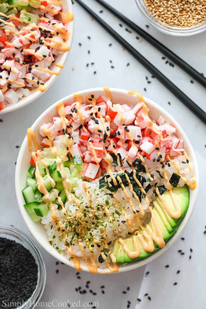 California Sushi Bowl with black sesame seeds and chopsticks nearby