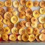 Close up of Baked Plantain Chips on a baking sheet pan.