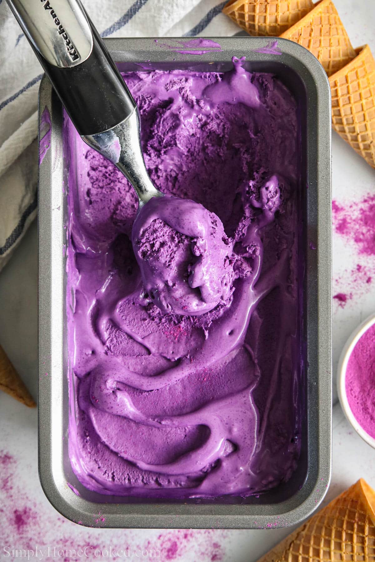 Ube Ice Cream being scooped from a pan.