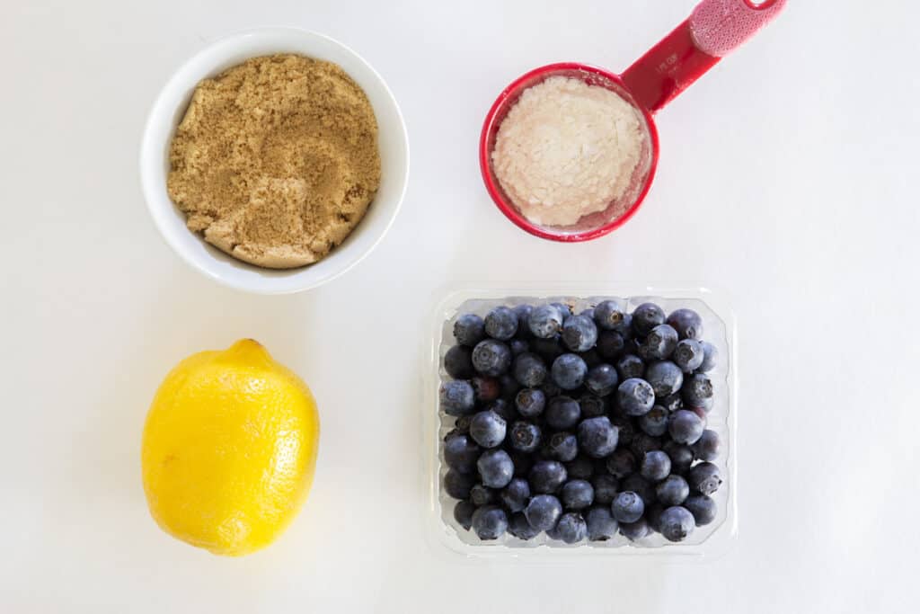 Ingredients for the blueberry center for Blueberry Oatmeal Bars, including brown sugar, blueberries, lemon juice, and flour.
