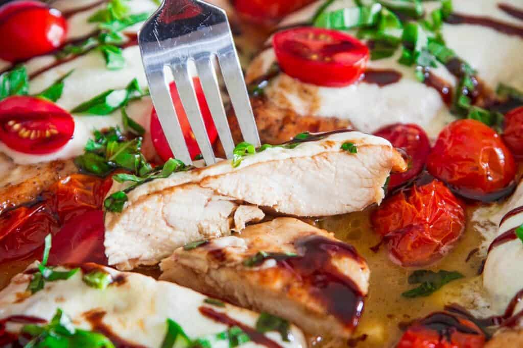 Horizontal image of a forkful of Chicken Caprese