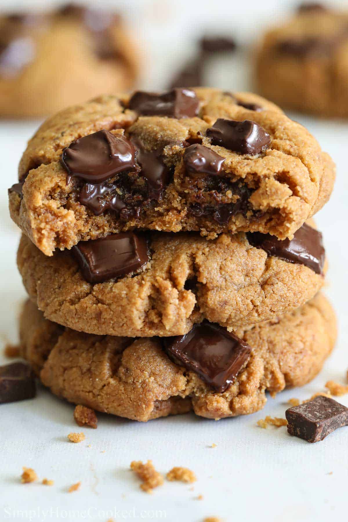 Close up of a stack of Coconut Flour Cookies, one missing a bite.