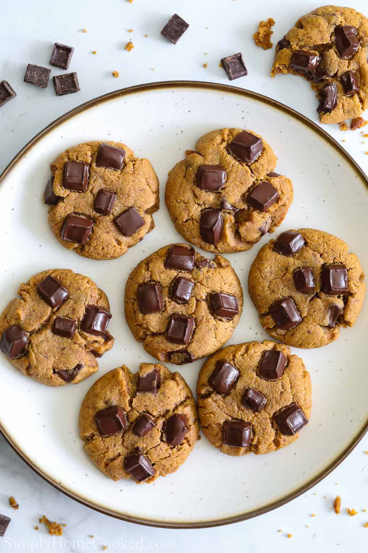 Plate of Coconut Flour Cookies, one bitten nearby