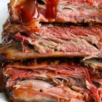 Vertical image of stacked Smoked Ribs