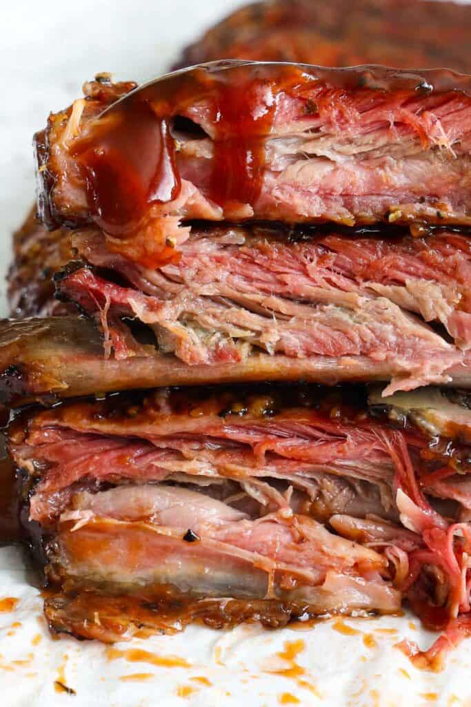 Vertical image of stacked Smoked Ribs
