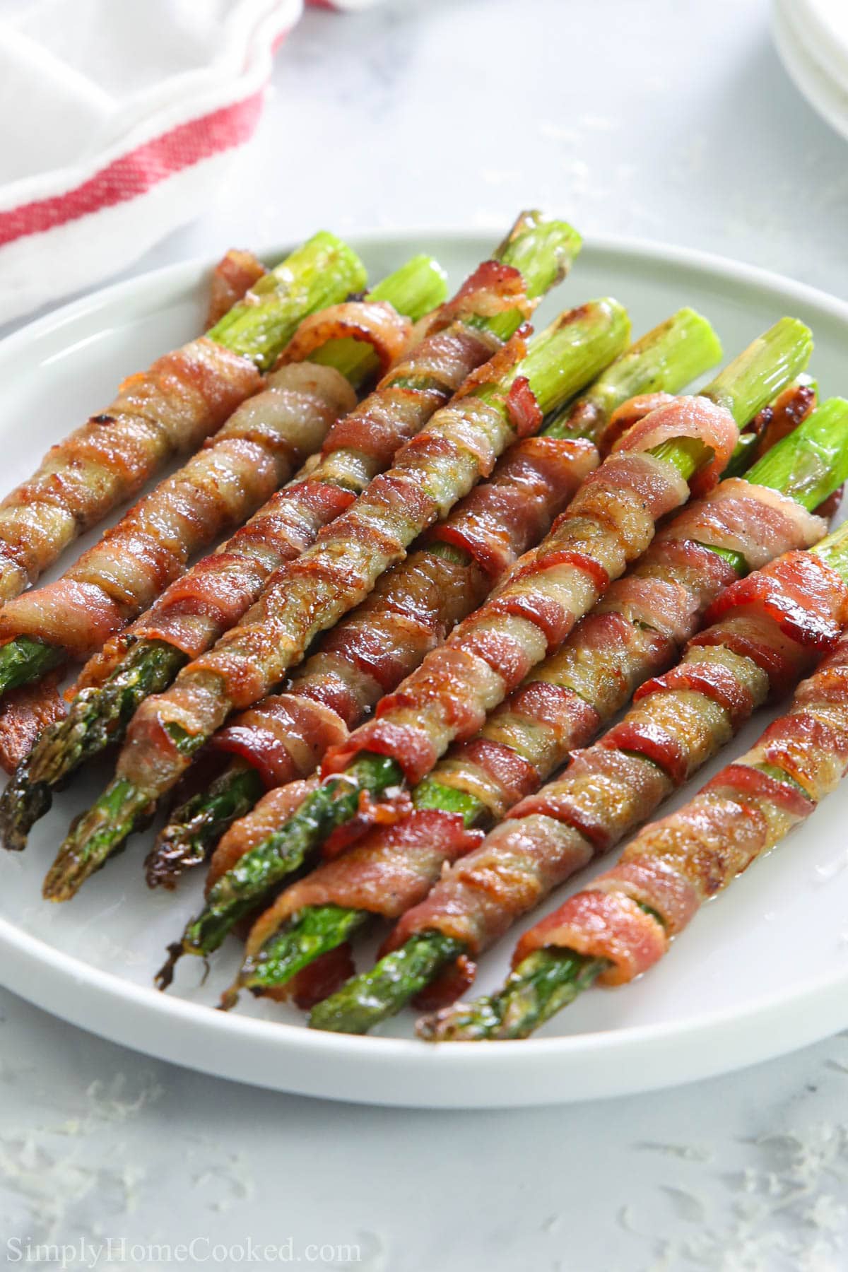 Vertical image of Bacon Wrapped Asparagus on a plate