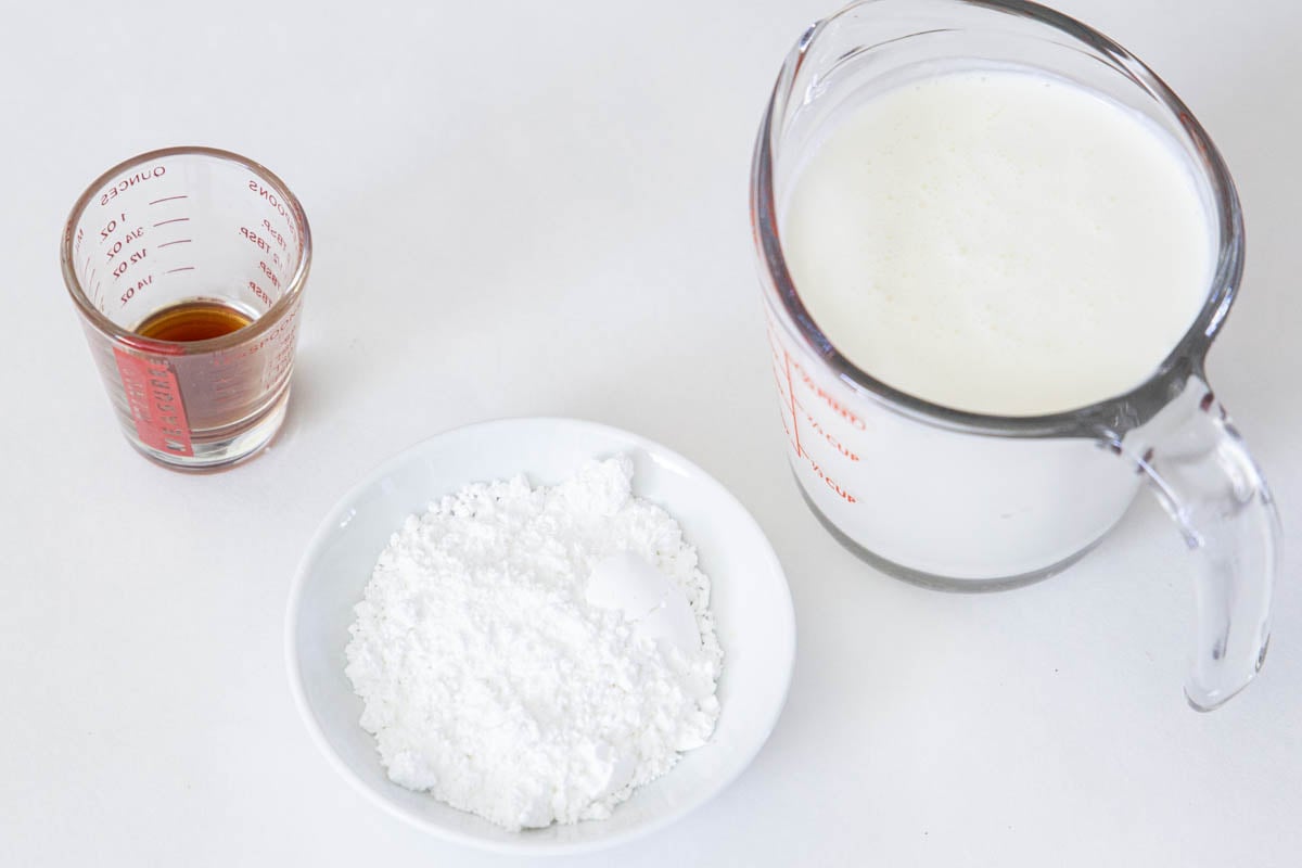 Ingredients for Chantilly Cream , including heavy cream, powdered sugar, and vanilla extract.