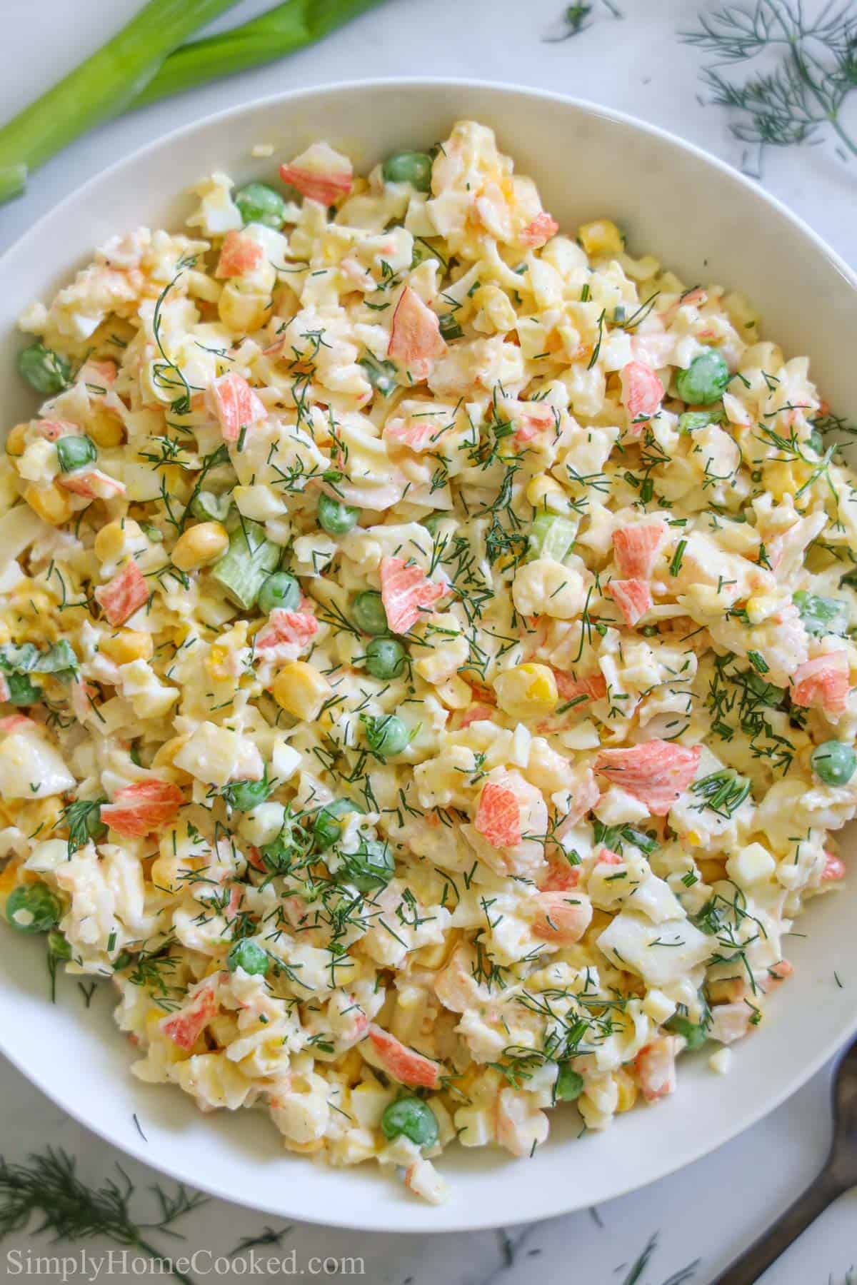 Vertical image of a bowl of Crab Salad.