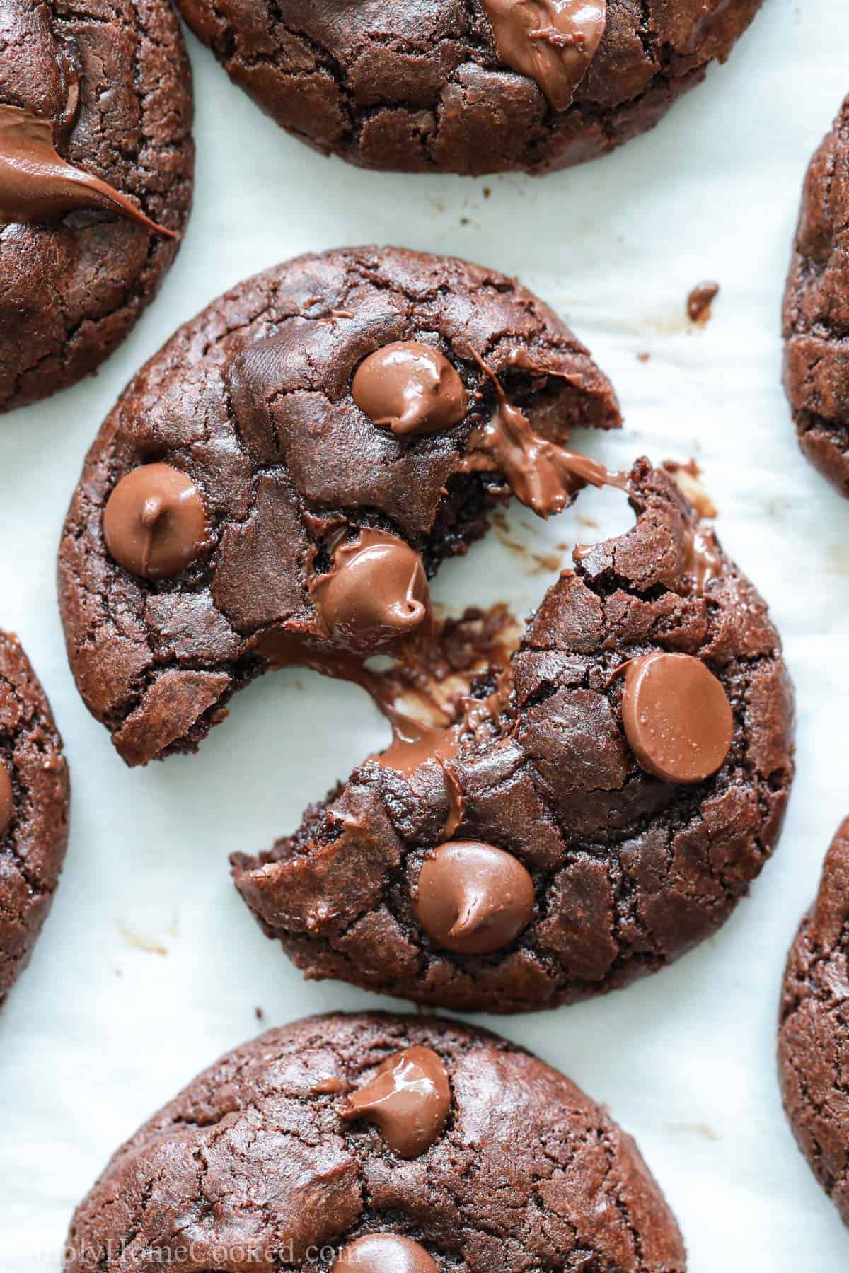 Vertical image of Double Chocolate Cookies, one pulled apart