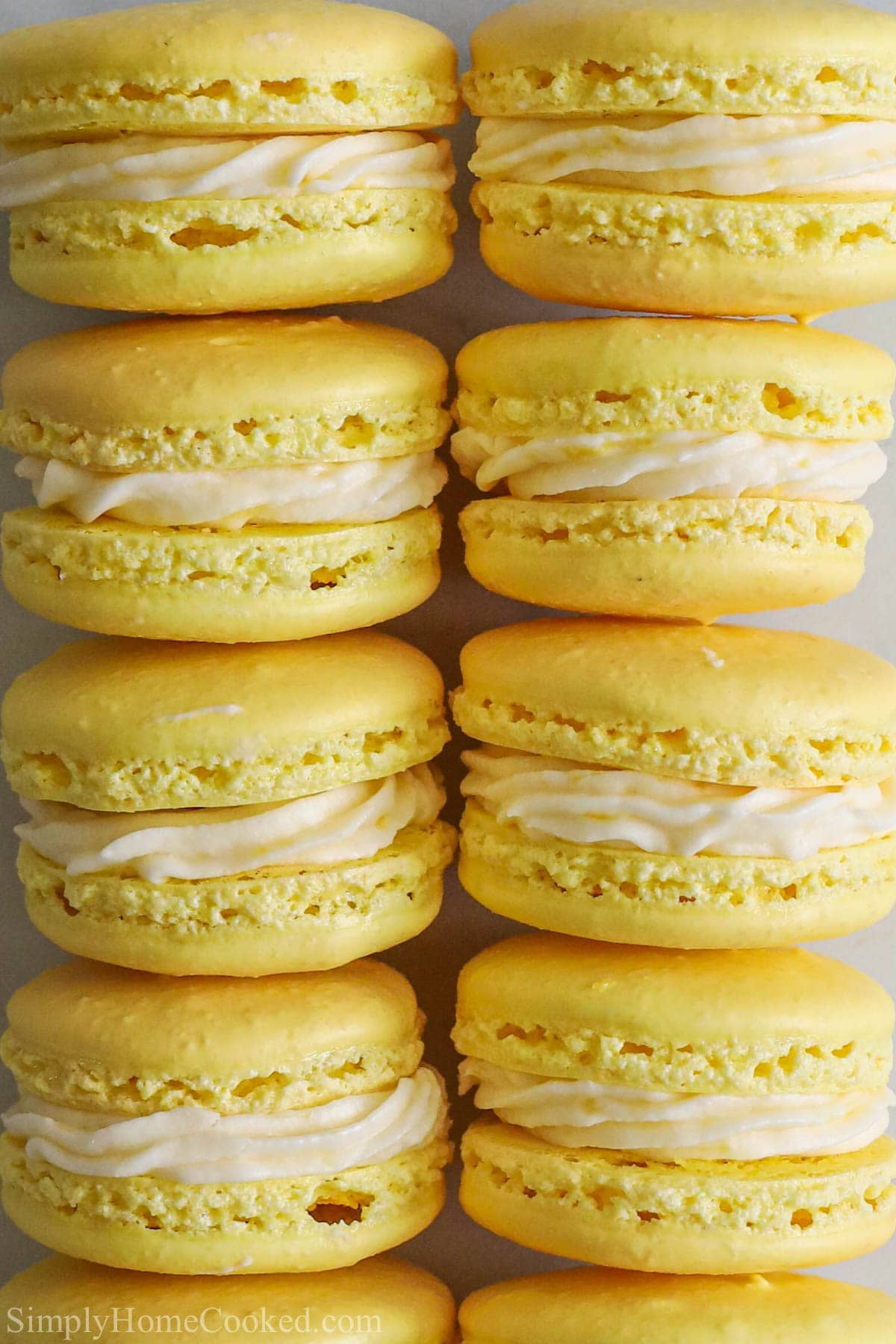 Vertical image of stacks of Lemon Macarons
