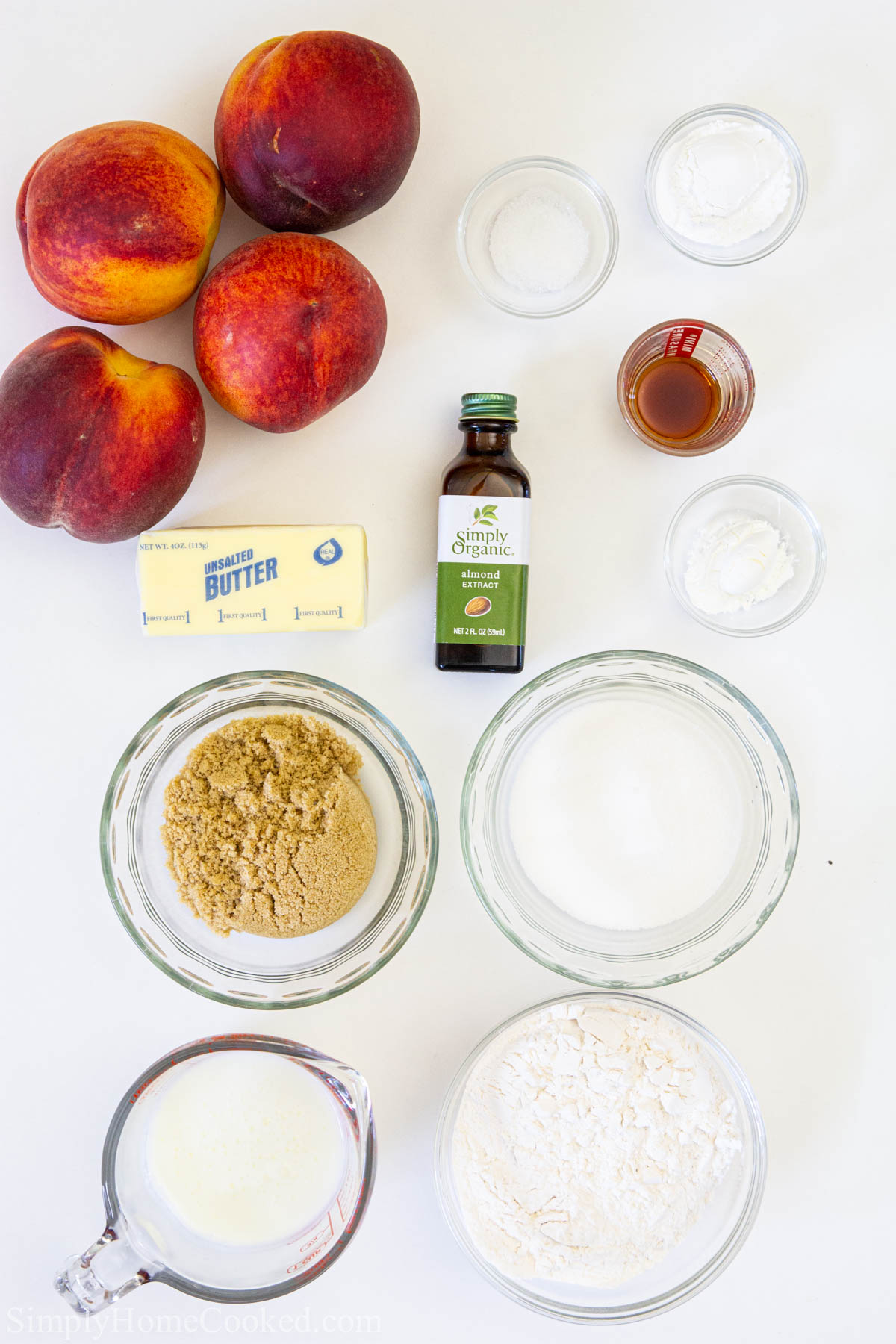 Ingredients for Easy Peach Cobbler recipe, including peaches, sugar, flour, salt, cornstarch, vanilla and almond extracts, baking powder, butter and buttermilk. 