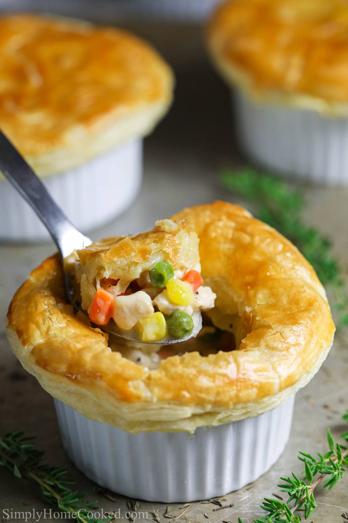 Vertical image of a spoonful of Mini Chicken Pot Pie.