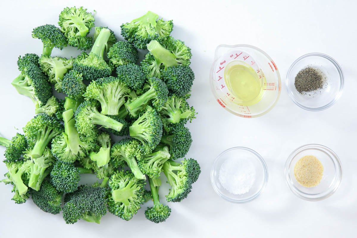 Ingredients for Crispy Air Fryer Broccoli including broccoli, olive oil, salt, pepper, and garlic powder.