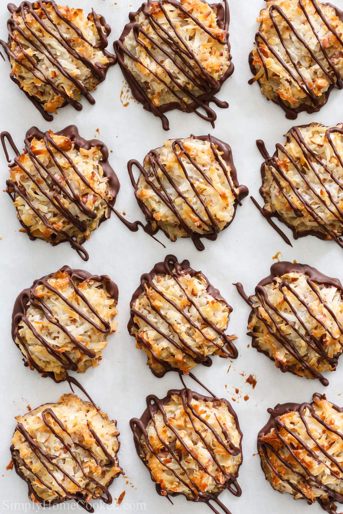 Vertical image of Almond Joy Cookies on parchment paper