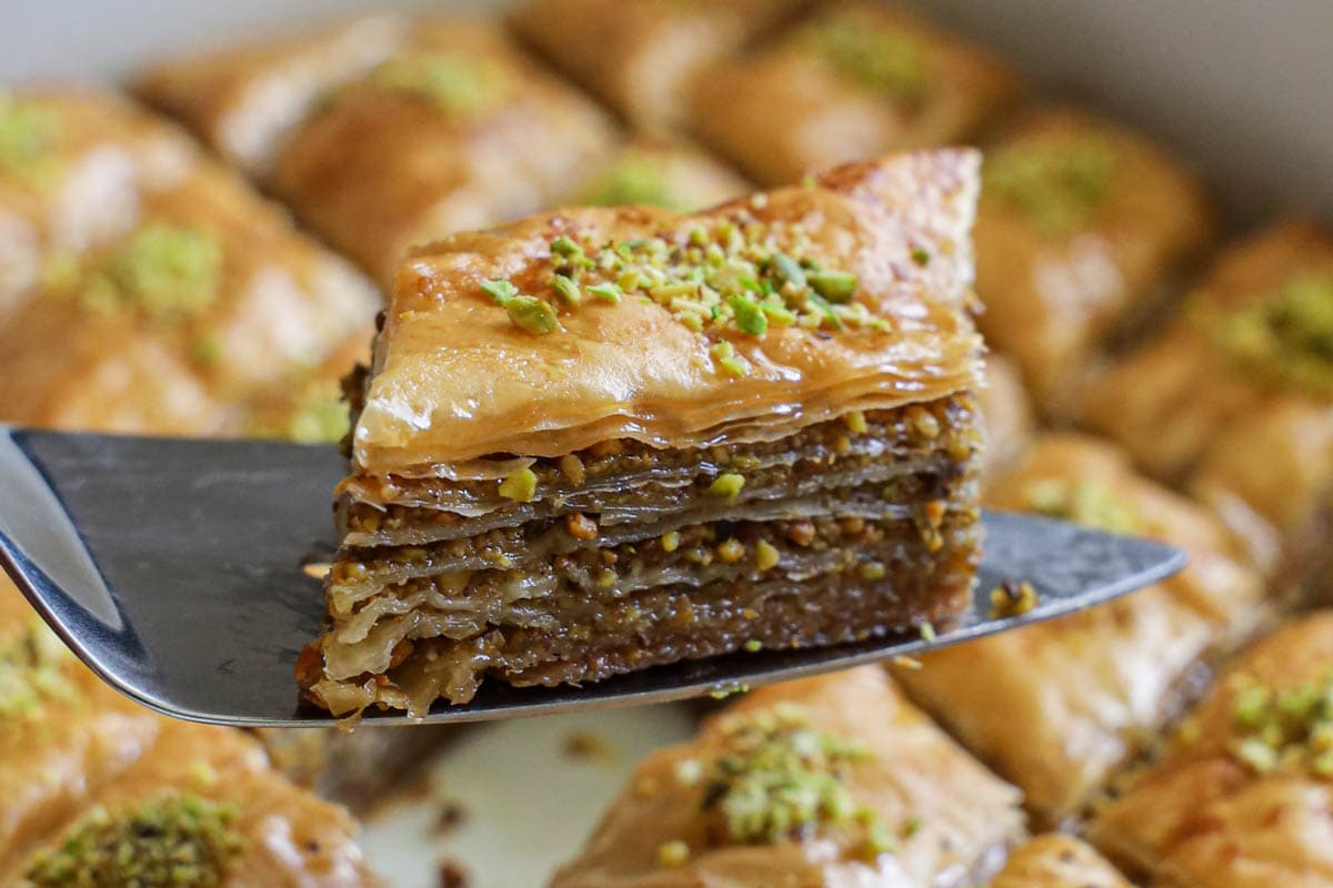 Close up of a slice of Baklava on a serving kniife.