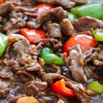 square image of pepper steak in a wok