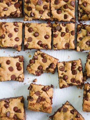 Vertical image of Chocolate Chip Cookie Bars, one missing a bite