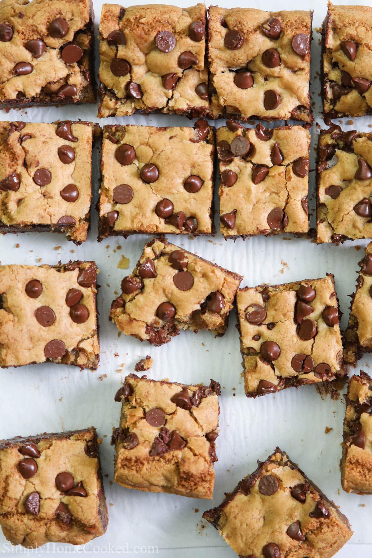 Vertical image of Chocolate Chip Cookie Bars, one missing a bite