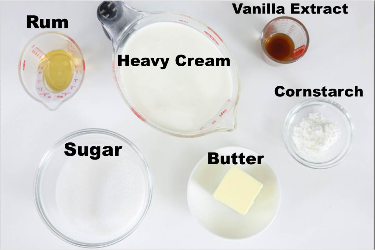 Ingredients for Bread Pudding Sauce, including heavy cream, rum, butter, sugar, vanilla, and corn starch. 