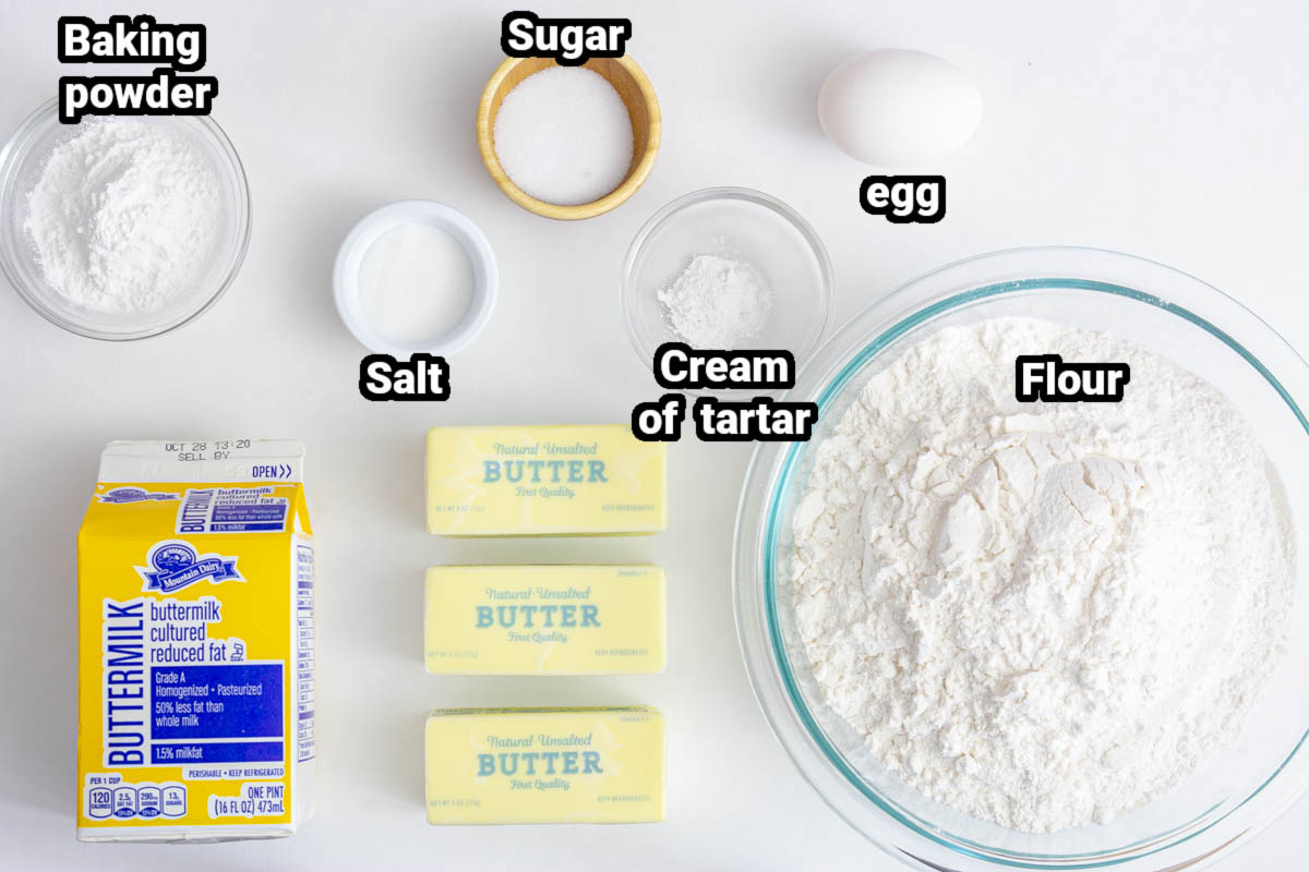 Ingredients for Buttermilk Biscuits, including flour, sugar, salt, egg, cream of tartar, egg, buttermilk, and baking powder.