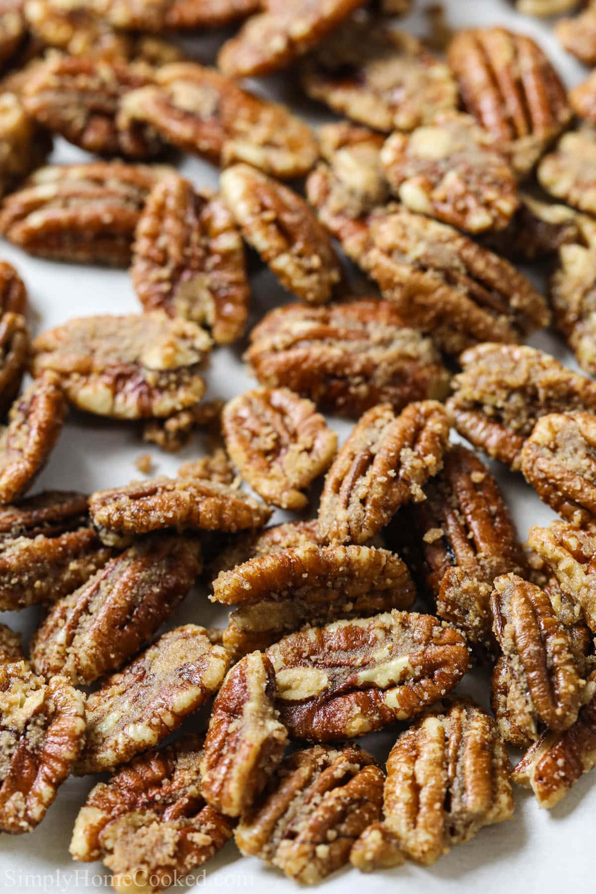 Vertical image of a close up of Candied Pecans.