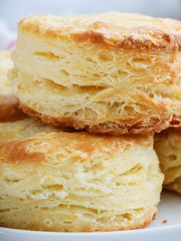 a stack of flakey buttermilk biscuits